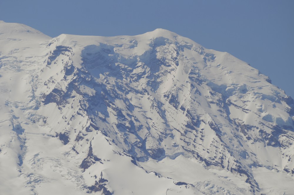 A close up shot of Mt. Rainier and what appears to be an avalanche of some sort. With the mountain just 10 miles away, our long lens afforded us extremely close shots. (Photo by Craig Craker)