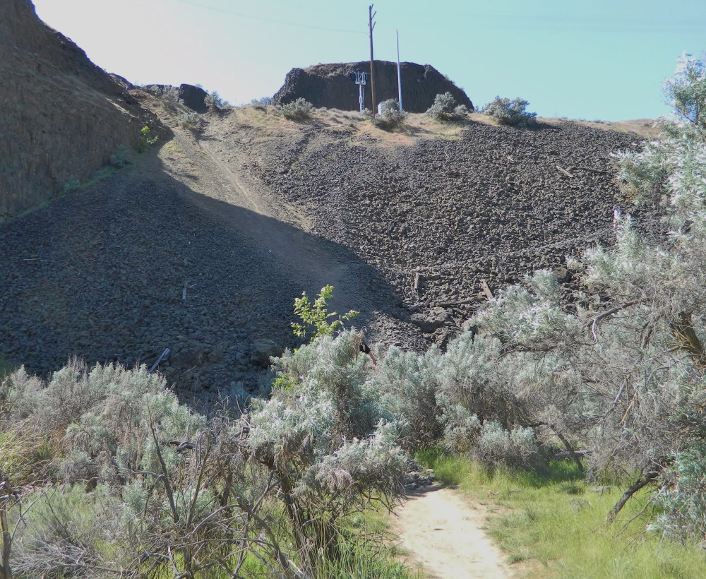Avoid going down the path in the upper middle of this photo, it is steep and slick. Use the trail that switchbacks on the right side - you can see it faintly cut into the railroad rocks.