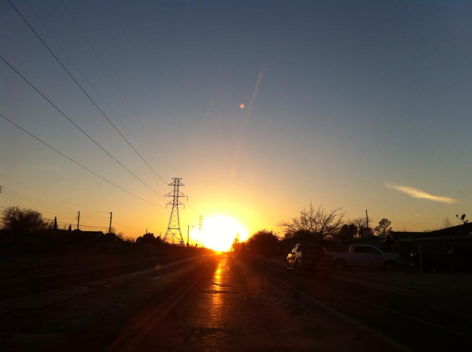 This was taken with my iPhone in Odessa, Texas. It is so flat in Odessa, that when the sun sets it appears you are driving straight into it. It is an amazing sight.