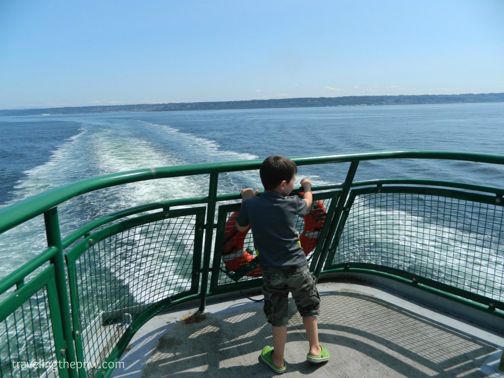 Our nephew Emmett showing no fear while standing at the back of a Washington state ferry motoring through the Puget Sound.