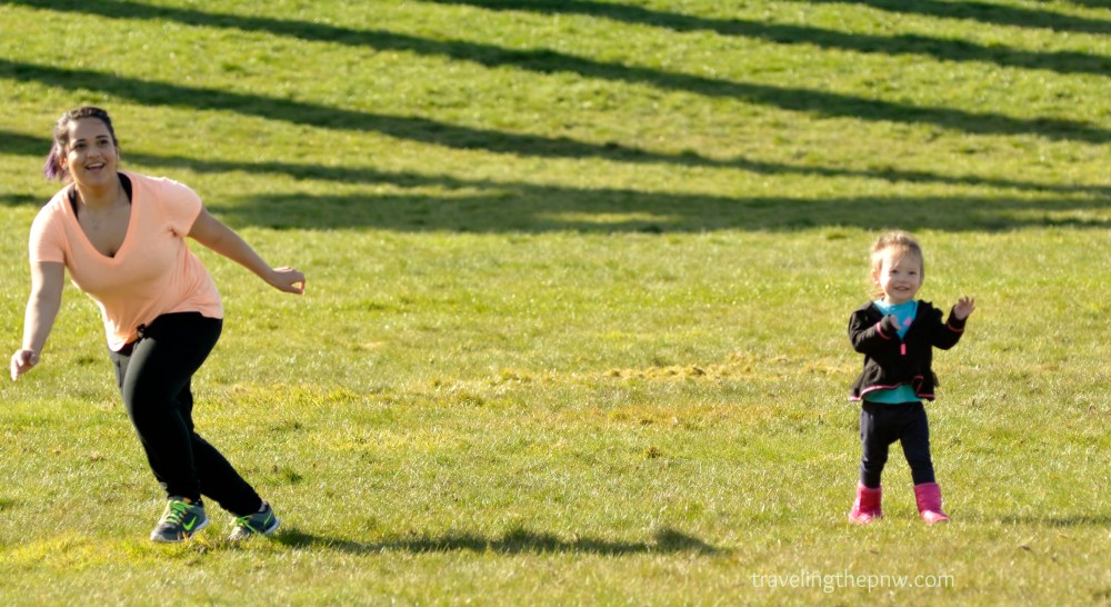 Veronica's sister, Tori, and Catarina look for the frisbee as it flies their way. This is in the Central Meadow part of Chambers Bay regional park. 
