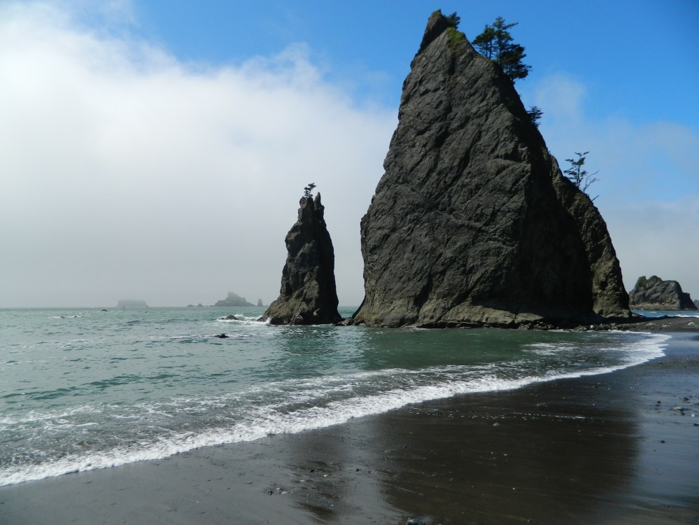 As the clouds rolled back at Rialto Beach, they offered an amazing blue sky which augmented the arrowhead looking sea stacks near the Hole in the Wall.