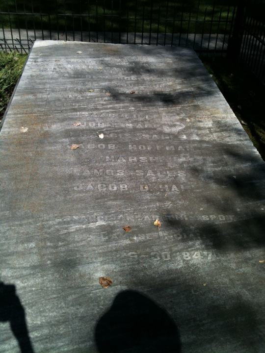The headstone for the mass grave of many of the 13 who died in the massacre.