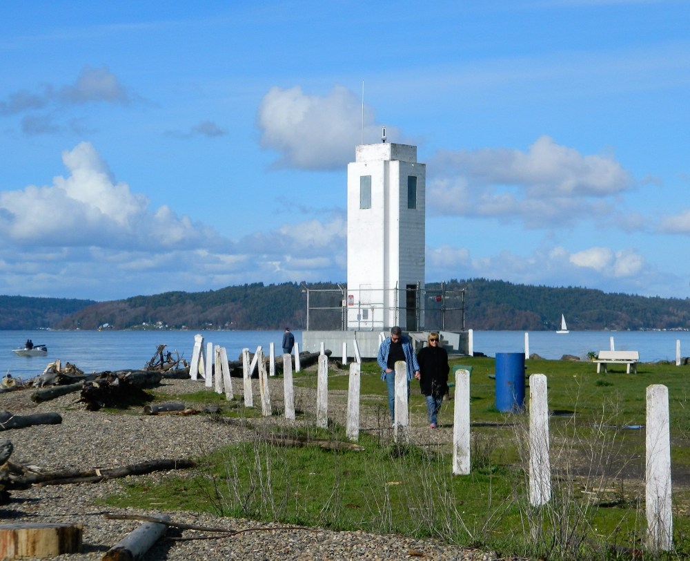 The lighthouse stands guard at the end of Browns Point helping direct the massive container ships headed to the Port of Tacoma.