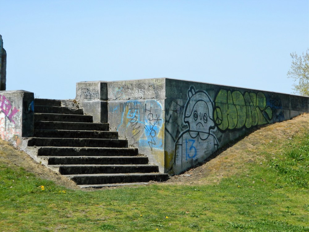 Part of the Hill Ward Dormitory ruins on the grounds of the old Western State Hospital. There is lots of graffiti covering the ruins.