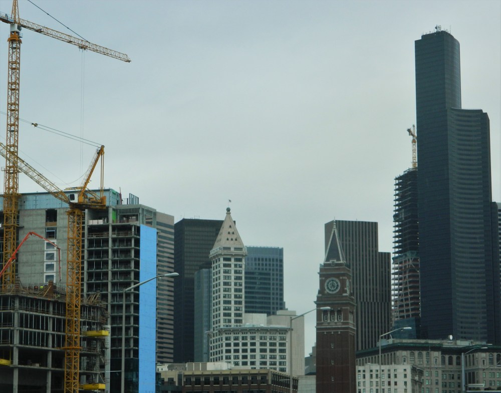 The Smith Tower, white building in the center, was completed in 1914. It is quickly being surpassed by modern buildings.
