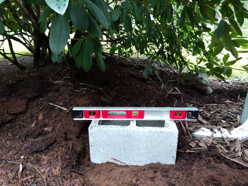 There is a pretty big mound here from years of pine needles falling in this area, so I had to do some major construction.